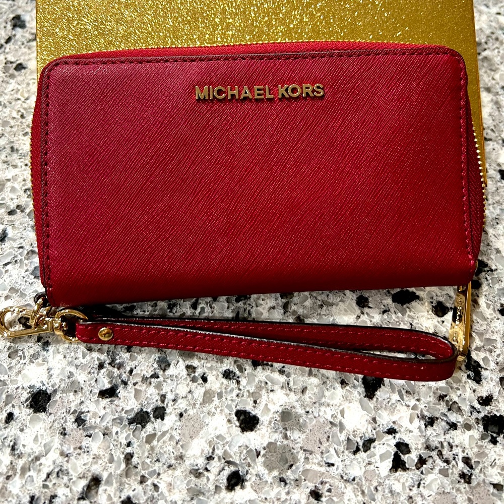 NWOT Michael Kors tech friendly wallet in gift box. Color: cherry. Never used.